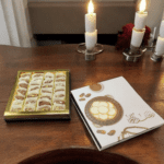 Ramzan Kareem Box of assorted chocolates on a wooden table.